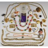 A collection of costume jewellery including Sarah Coventry and Monet brooches, coral necklace,