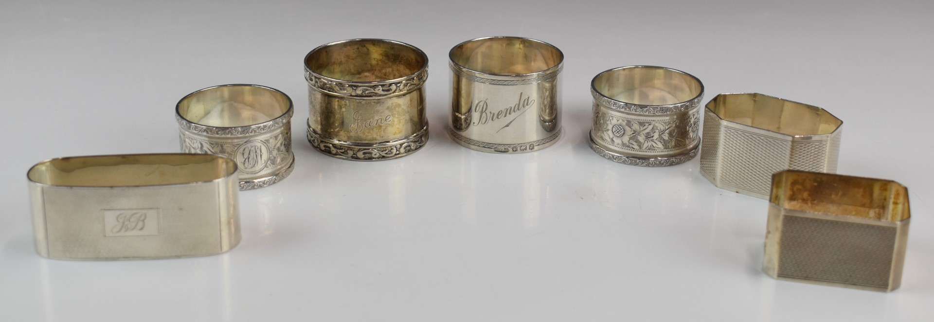Seven various hallmarked silver napkin rings including a pair of Art Deco style engine turned - Image 2 of 7