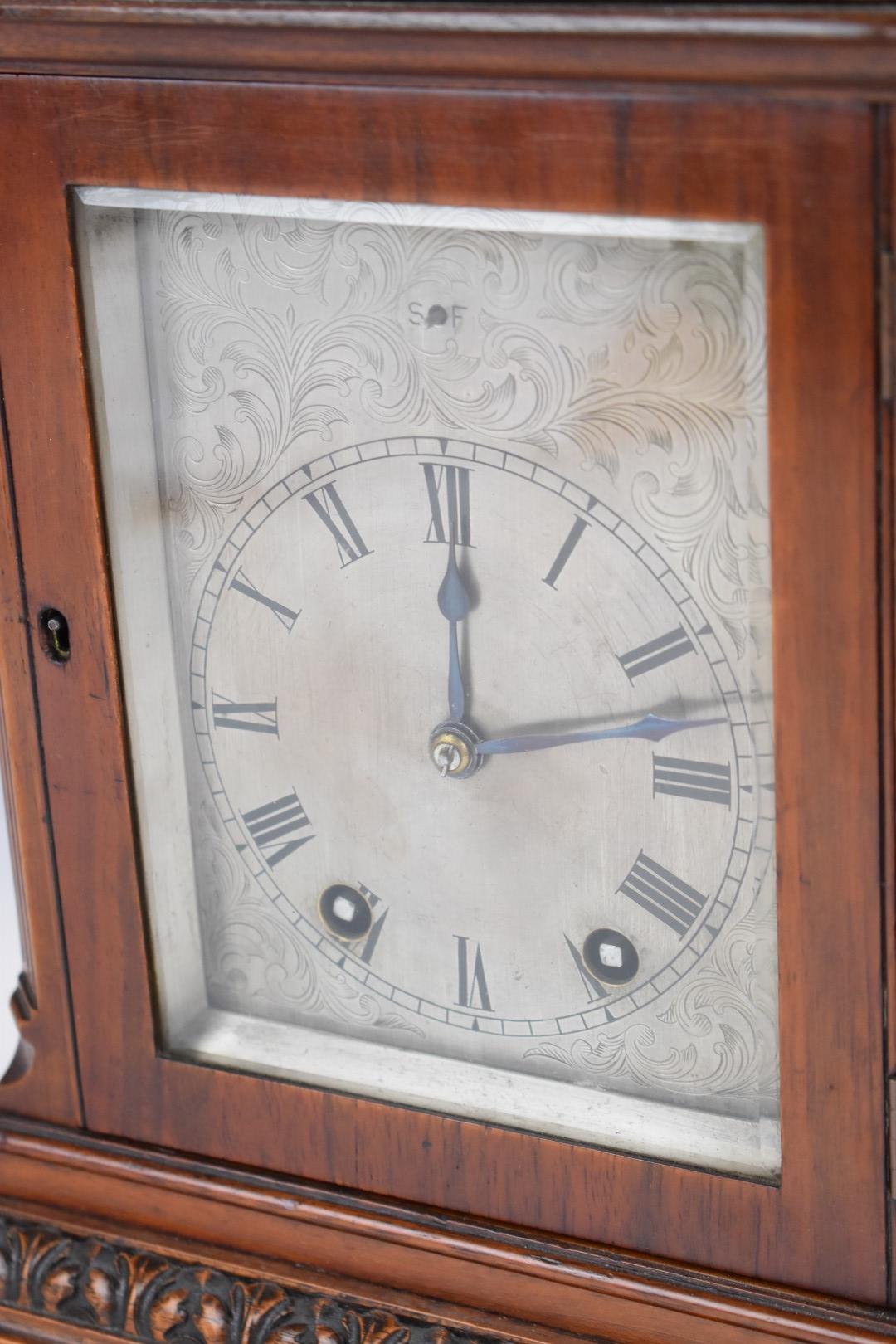 19th or early 20thC mahogany bracket clock with carved decoration, the silvered dial having slow and - Image 10 of 10