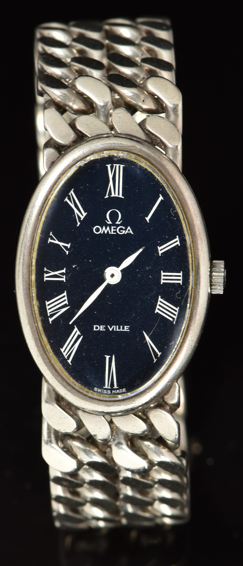 Omega De Ville silver wristwatch ref. 1011 with white hands and Roman numerals, blue dial and signed