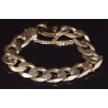 A large 9ct gold curb link bracelet, 89g
