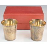 Cased pair of Elizabeth II feature hallmarked silver beakers or tumblers, Birmingham 1973, maker