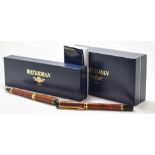 Waterman Red Ripple Rhapsody fountain and ballpoint pen set both with gold plated fittings, in