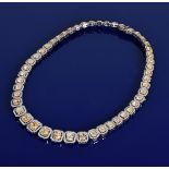 A fancy diamond set necklace or collarette set with forty eight cushion cut yellow diamonds, the