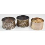 Three hallmarked silver napkin rings including a pair, London 1905, maker William Hutton & Sons Ltd,