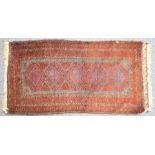Small Turkoman prayer rug with five guls on a wine ground, 102 x 56cm
