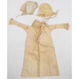 18th/19thC silk doll's dress and bonnet with ruffed trim to cuffs and neckline, length 30cm