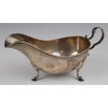 Birks American silver sauce boat raised on three feet, marked to base Birks Sterling, length 19cm,