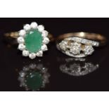 A 9ct gold ring set with diamonds in a platinum setting and a 9ct gold ring set with an emerald