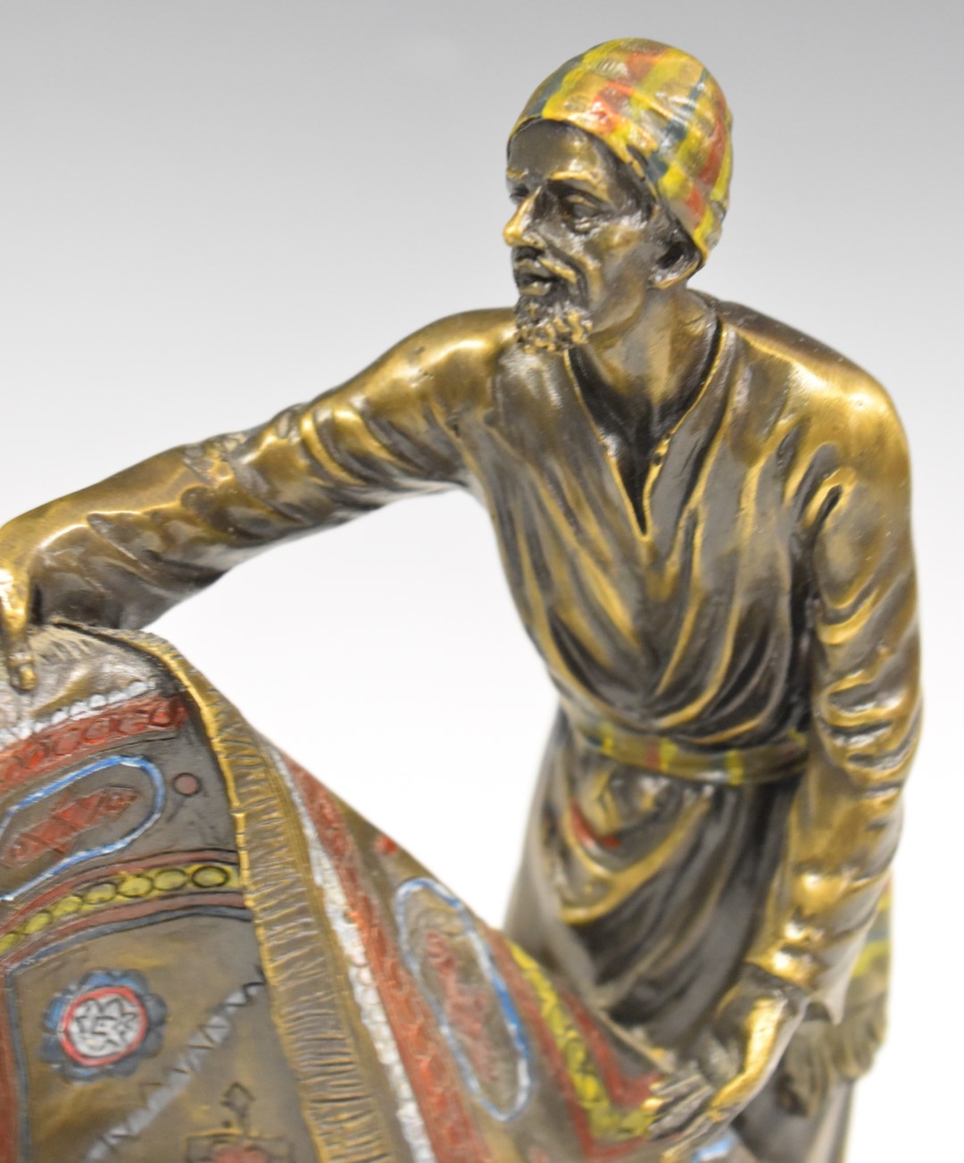 Cold painted bronze figure of an Arab / Eastern carpet seller with impressed Bergman and with - Image 3 of 10