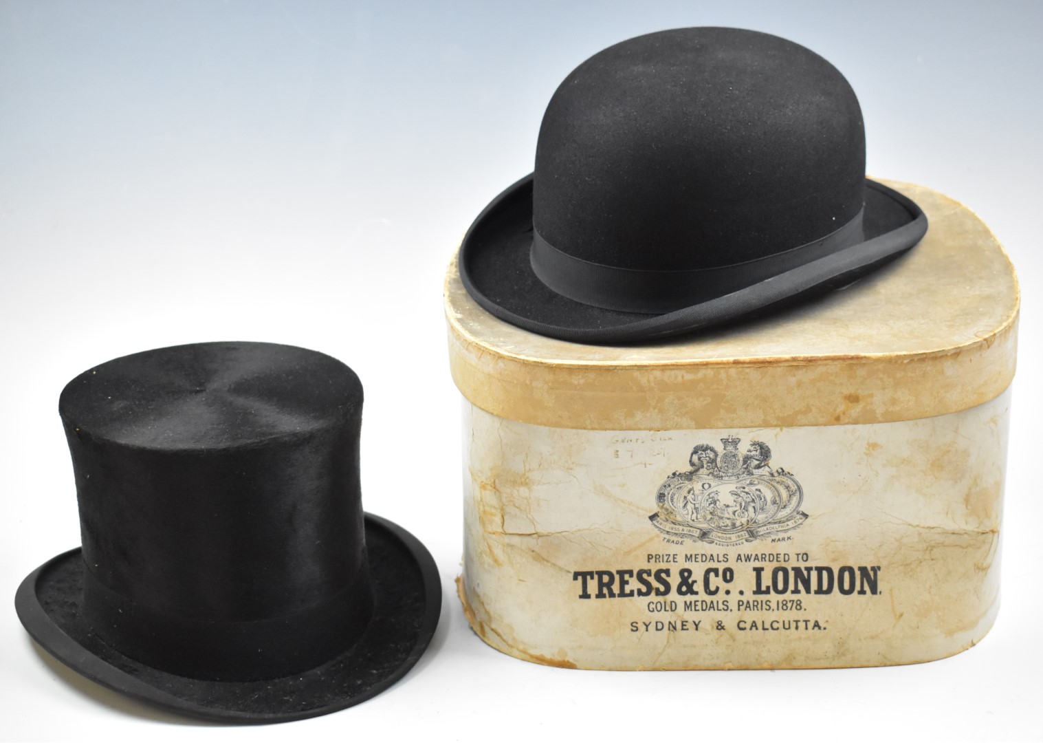 Silk top hat by Tress & Co, in hat box, together with a bowler hat