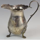 Elizabeth II hallmarked silver jug raised on three lion paw feet, Birmingham 1970, maker Joseph