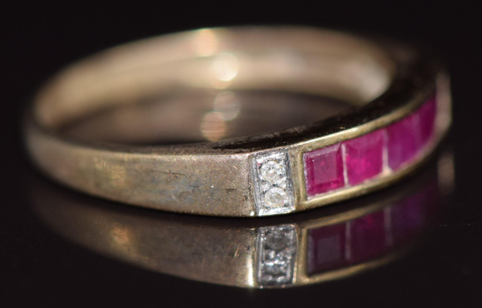 A 9ct gold ring set with calibre cut rubies and diamonds, 1.9g, size M - Image 2 of 2