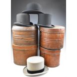 Four top hats in hat tins including 'Gardner, Hatter, Stroud', Christys' of London etc