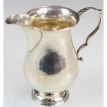 George VI hallmarked silver jug of baluster form, Birmingham 1939, maker William Hutton & Sons