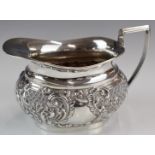 Edward VII hallmarked silver milk jug with embossed decoration, Birmingham 1901, maker William