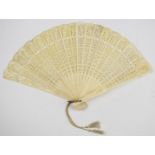 19thC carved bone fan, the guard sticks 22.5cm