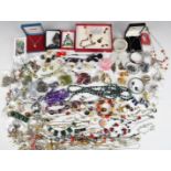 A collection of costume jewellery including diamanté, silver suite of jewellery set with amber,