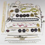 A collection of costume jewellery including rolled gold bangle, French jet necklace, enamel belt