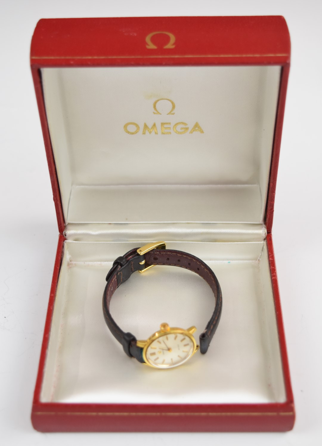 Omega De Ville ladies wristwatch with two-tone hands and hour markers, silver dial, gold plated case