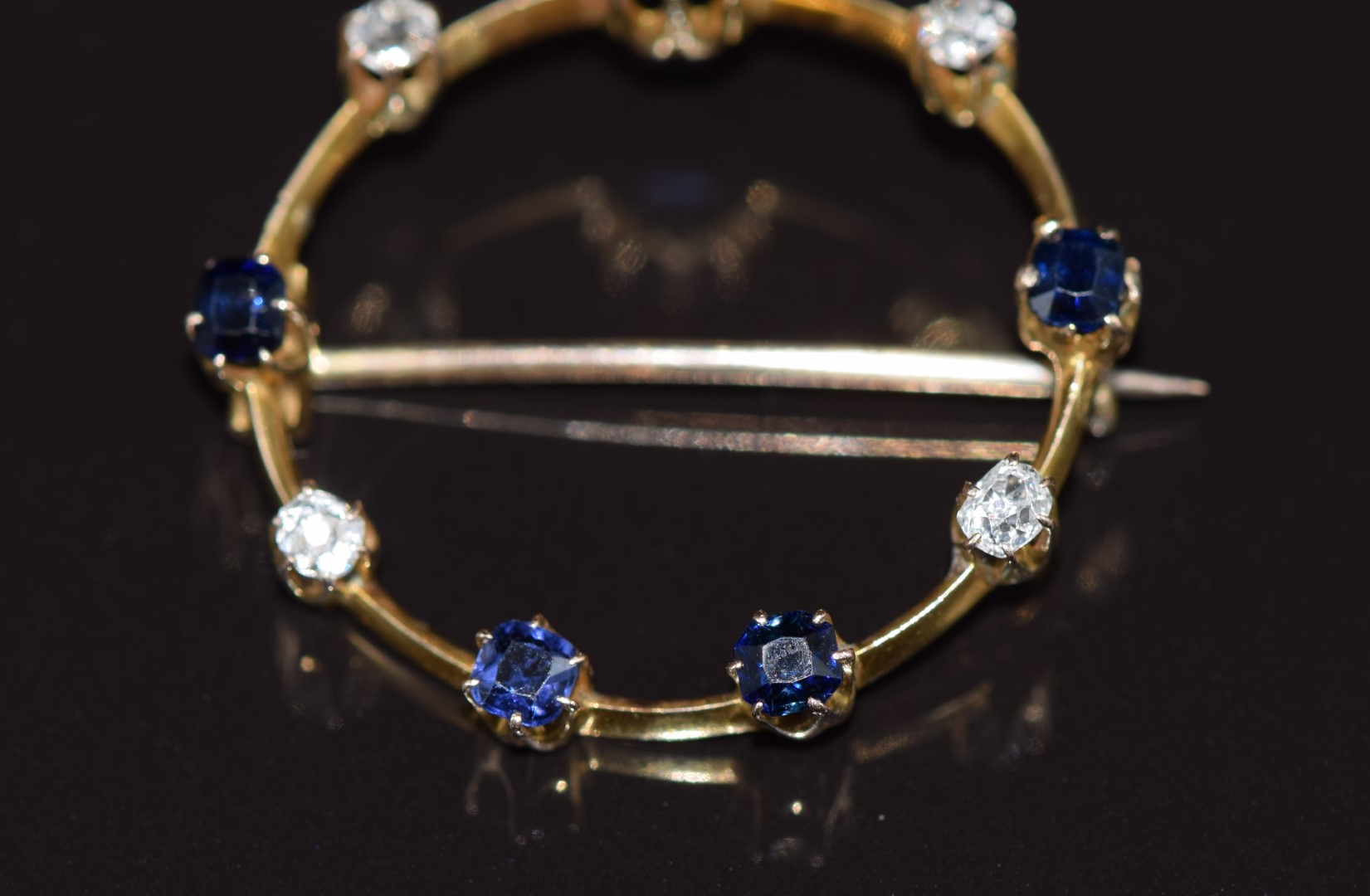 A c1915 9ct gold brooch set with sapphires and old cut diamonds, 2.7g 2.6cm - Image 2 of 3