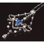 A c1900 18ct white gold necklace in a stylised bow design set with a natural Ceylon cornflower
