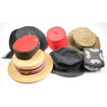 A collection of vintage hats including two straw boaters, Spanish felt hats, fez examples etc