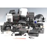 Cameras including two Canon 35mm SLR comprising EOS 500 and EOS 33, with Sigma 28-105mm 1:4-5.6,