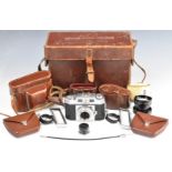 Agfa Karat 35mm bellows camera, together with two Proximeter cased Yashica lenses, all housed in a