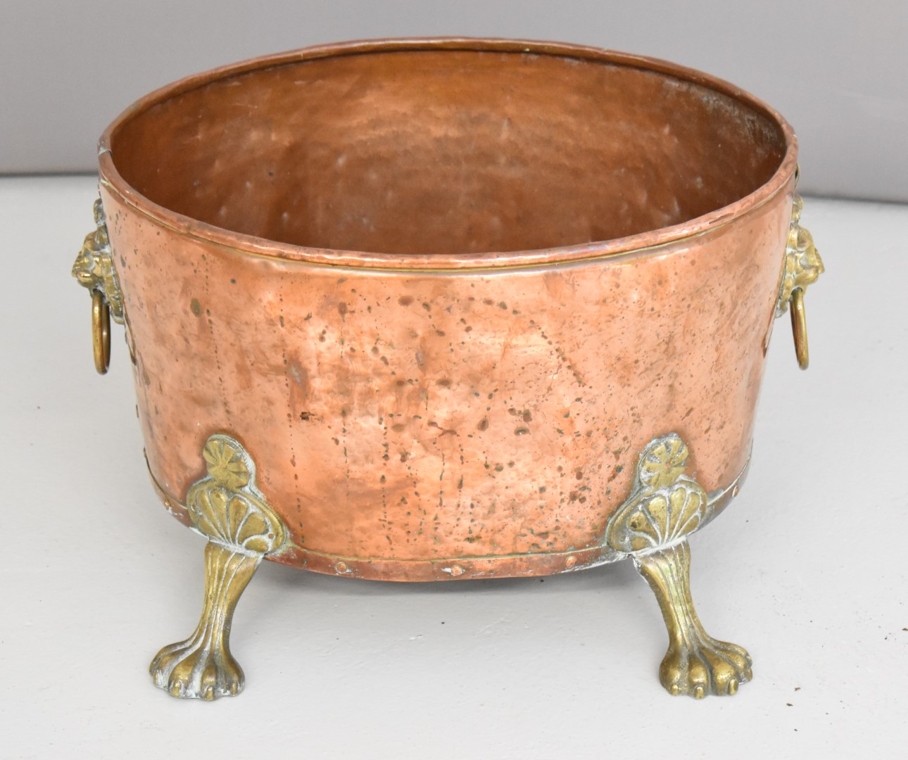 Georgian style riveted copper oval coal box / log bin with lion mask handles, W42 x D34 x H29cm