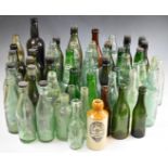A collection of vintage beer / ginger beer bottles including Stroud, Cheltenham, Gloucester and
