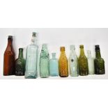Vintage bottles including Warn & Sons Tetbury, Arnold Perrett, Flag Sauce, Stroud Brewery, Bown & Co