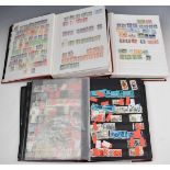 A collection of GB and world stamps in various albums and folders including France, USA, Belgium