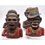 Four cast iron novelty money boxes, height 19cm