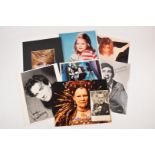 A collection of autographed / signed photographs including Judi Dench, Joanna Lumley, Norman Wisdom,