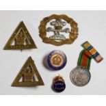 Three On War Service badges, a Home Guard badge, South Lancashire Prince of Wales Volunteers bi-