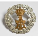 The Princess of Wales' Own Yorkshire Regiment cap badge