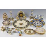 Collection of continental faience ware ceramics including figural cat dish, clock, candlesticks,