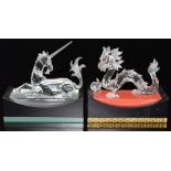 Two Swarovski Crystal glass animals dragon and uniform, both on display plinths, each base 15cm