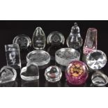 Fourteen glass paperweights including Caithness and Dartington, some limited edition and some with