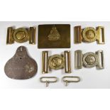 Four belt buckles including Royal Marines, Coldstream Guards and Dieu Et Mon Droit and a foot locker