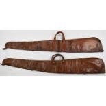 Two leather shotgun or rifle slips, both with wool lined interiors.
