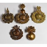 Five Royal Marines badges including Labour Corps, Light Infantry and Artillery