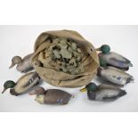 Six Sport Plast and Carry Lite floating duck decoys and hide webbing, in a canvas bag