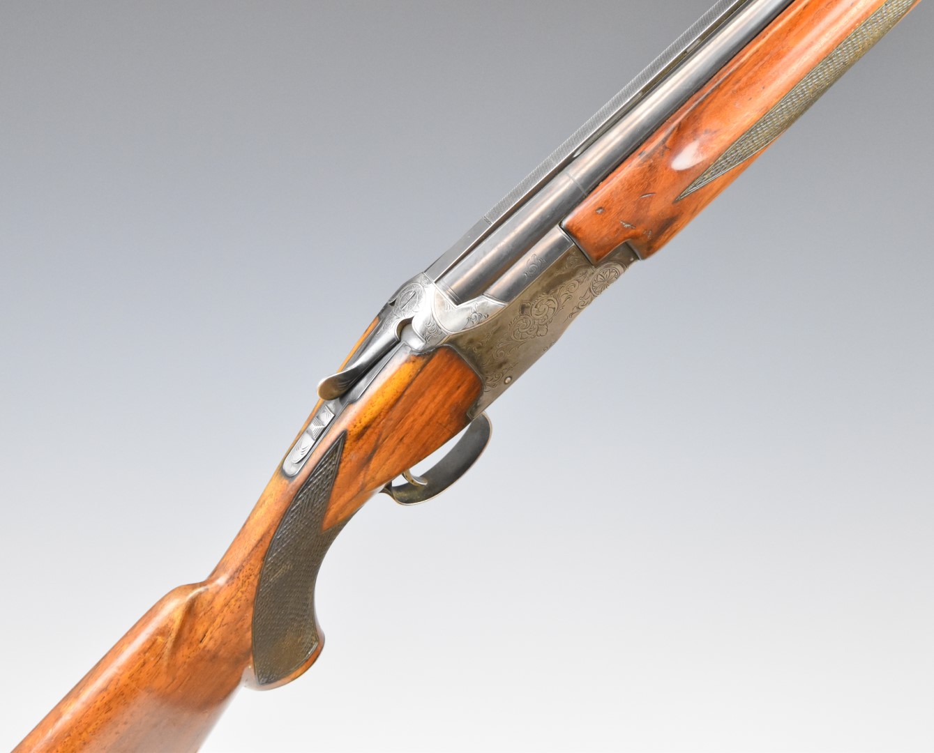 Winchester 101 12 bore over and under ejector shotgun with engraved lock, trigger guard, thumb