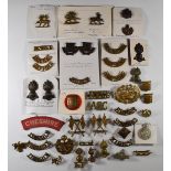 Approximately forty metal shoulder and collar badges including Royal Engineers, the Buffs, Essex