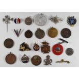 A small collection of medallions and badges including, the Civil Defense Corps, Gaunt London with '