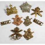 Eight British Army Machine Gun Corps badges including the Guards and Royal Navy Division, together