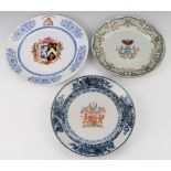 A set of three armorial plates, two with Chinese marks verso, largest diameter 30cm