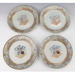 A set of four armorial plates with enamelled decoration and Latin script, diameter 26.5cm